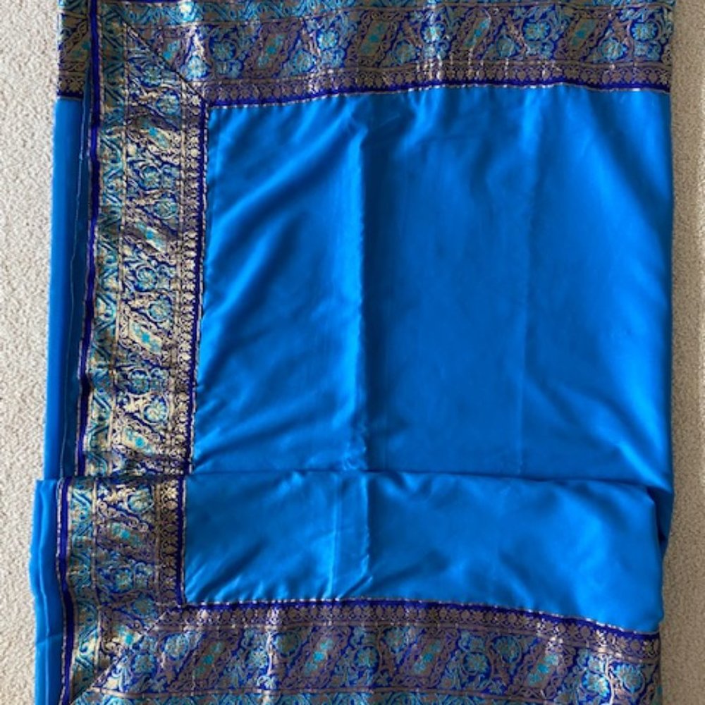 - Blue Nylon Georgette sari 6 yards with wide golden decorative border attached